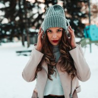 woman with headphones listening to music on a snowy winter day - fashion stock pictures, royalty-free photos & images