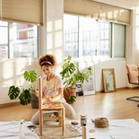 woman with paint upcycling chair at home - home decoration stock pictures, royalty-free photos & images