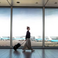 woman with suitcase is going to board on the next flight - travel stock pictures, royalty-free photos & images