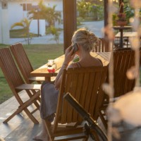 woman works from home on outdoor patio in the morning - garden decoration stock pictures, royalty-free photos & images
