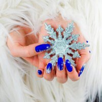 womans hands with nail art holding a christmas snowflake decoration - nails art stock pictures, royalty-free photos & images