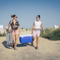 women carrying cooler at beach - food stock pictures, royalty-free photos & images