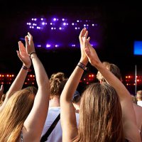 women clapping hands at big concert - concert stock pictures, royalty-free photos & images