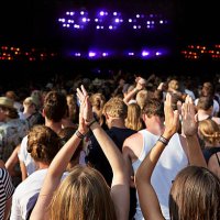 women clapping hands at large concert - concert stock pictures, royalty-free photos & images