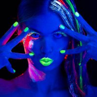 women portrait with glowing multi colored makeup in black light - nails art stock pictures, royalty-free photos & images
