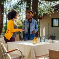 women setting table for lunch. - garden decoration stock pictures, royalty-free photos & images