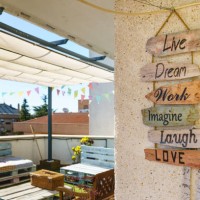 wooden decoration sign with positive emotions at sunny home terrace - garden decoration stock pictures, royalty-free photos & images