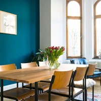 wooden table and chairs with large window front in modern living room in stylish apartment - home decoration stock pictures, royalty-free photos & images