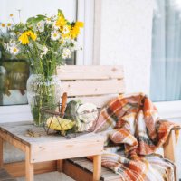 wooden table with wildflowers in vase and vegetables squash in basket in the backyard of house - garden decoration stock pictures, royalty-free photos & images