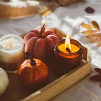 wooden tray with atmospheric candles and aututmn fall leaves on white bed. - home decoration stock pictures, royalty-free photos & images