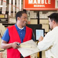 worker and contractor discussing plans in home improvement store - home decoration stock pictures, royalty-free photos & images