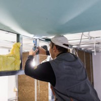 worker is fixing the drywall - home decoration stock pictures, royalty-free photos & images