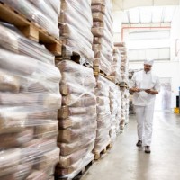 worker taking inventory of the flour at an industrial bakery - food stock pictures, royalty-free photos & images