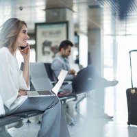 working and using phone while waiting on departure gate. - travel stock pictures, royalty-free photos & images