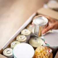 working at charitable foundation, packing donation box - food stock pictures, royalty-free photos & images