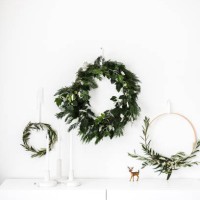 wreaths hanging on a wall by a sideboard - home decoration stock pictures, royalty-free photos & images