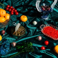 xmas modern dinner table setting on green velvet fabric background. creative merry christmas celebration concept. contemporary new year festive backdrop - food stock pictures, royalty-free photos & images