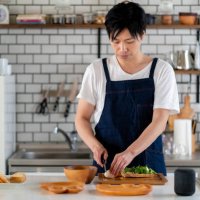 young adult male cooking at home alone - food stock pictures, royalty-free photos & images