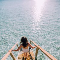young adult woman chasing the sun in maldives - fashion stock pictures, royalty-free photos & images