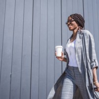 young, african-american businesswoman walking from the airport - fashion stock pictures, royalty-free photos & images