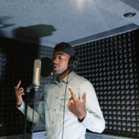 young african american male rapper, songwriter recording song in studio - concert stock pictures, royalty-free photos & images