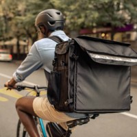 young african delivery man riding bicycle in the city - food stock pictures, royalty-free photos & images