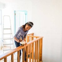 young afro-caribean woman renovating her home - home decoration stock pictures, royalty-free photos & images