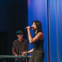 young asian chinese female lead singer and keyboard player live band group performance on stage - concert stock pictures, royalty-free photos & images