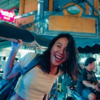 young asian woman tourist traveling by a tuk tuk vehicle on the street at bangkok, thailand. holiday vacation trip. - travel stock pictures, royalty-free photos & images