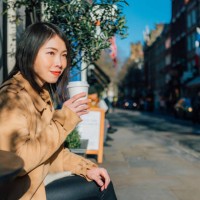 young beautiful woman drinking coffee at outdoor cafe - junk food stock pictures, royalty-free photos & images