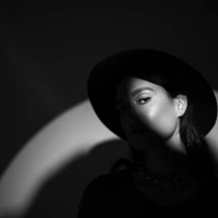 young beautiful woman portrait in round hat with shadow on her face - stock photo - fashion stock pictures, royalty-free photos & images