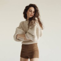 young beautiful woman wearing sweater and shorts - fashion stock pictures, royalty-free photos & images