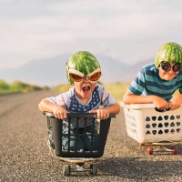 young boys racing wearing watermelon helmets - food stock pictures, royalty-free photos & images