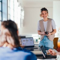 young business professionals working in a bright co-working space - fashion stock pictures, royalty-free photos & images