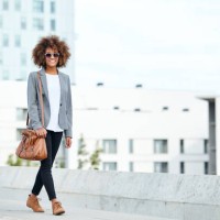 young businesswoman walking in city - fashion stock pictures, royalty-free photos & images