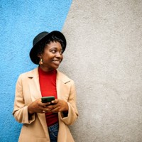young casually clothed woman posing in front of coloured wall - fashion stock pictures, royalty-free photos & images