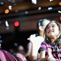 young child enjoying a concert with confetti - concert stock pictures, royalty-free photos & images
