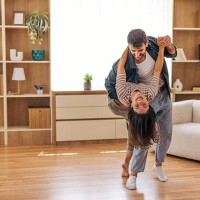 young couple dancing together at home, having fun and enjoying life - home decoration stock pictures, royalty-free photos & images