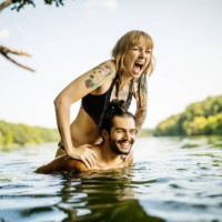 young couple having fun at the lake - travel stock pictures, royalty-free photos & images