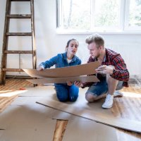 young couple improving their home. - home decoration stock pictures, royalty-free photos & images