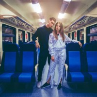 young couple in a train vehicle - fashion stock pictures, royalty-free photos & images