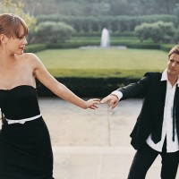 young couple in evening dress parting in formal garden - garden decoration stock pictures, royalty-free photos & images