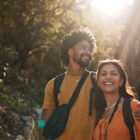 young couple looking away on sunny day - travel stock-fotos und bilder