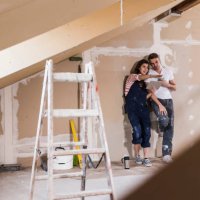 young couple on construction site of their new home, using digital tablet - home decoration stock pictures, royalty-free photos & images
