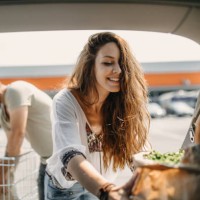 young couple packing groceries - food stock pictures, royalty-free photos & images
