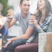 young couple relaxing with coffee to go - junk food stock pictures, royalty-free photos & images