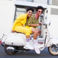 young couple riding a scooter - fashion stock pictures, royalty-free photos & images