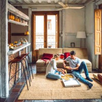 young couple sitting on floor of living room and eating pizza from box - junk food stock pictures, royalty-free photos & images