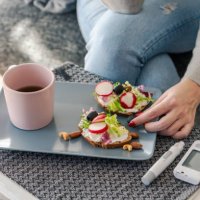 young diabetic woman having breakfast at home - food stock pictures, royalty-free photos & images
