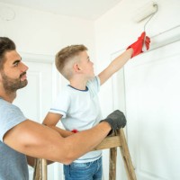 young family moving in a new house. - home decoration stock pictures, royalty-free photos & images